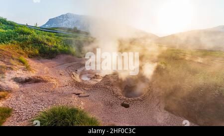 Steaming, sulfuric, active fumaroles near Pauzhetskaya Geothermal Power Plant, Kamchatka, Russia Stock Photo