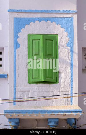 Decorative painted window with green shutters on a house in Udaipur, Rajasthan, India, South Asia Stock Photo
