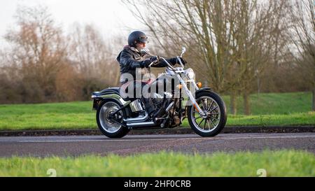 Man riding a Harley Davidson motorcycle Stock Photo