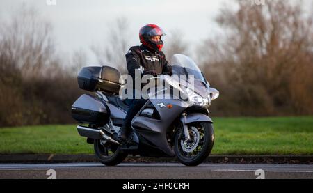 Man riding Honda pan european motorcycle Stock Photo