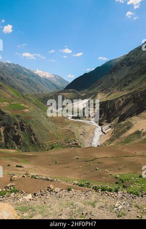 Beautiful View to the Pakistani Highland Gorge with the Mountain River in Gilgit Baltistan Stock Photo