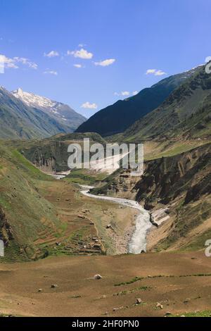 Beautiful View to the Pakistani Highland Gorge with the Mountain River in Gilgit Baltistan Stock Photo