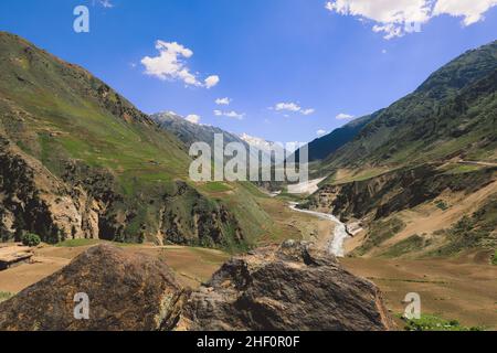 Beautiful View to the Pakistani Highland Gorge with the Mountain River in Gilgit Baltistan Stock Photo