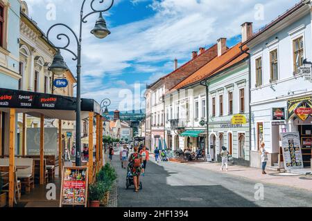 Banska Bystrica, Slovakia – August 17, 2021: summer cityscape – colorful buildings, street caffe, shops and walking people Stock Photo