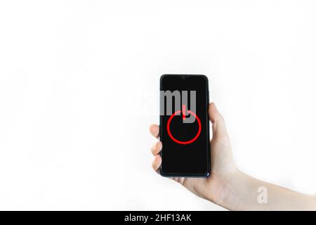 Hand holding phone with red off button on screen isolated on white background Stock Photo