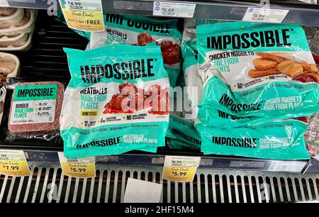 Impossible Foods frozen meat items made from plants in the freezer at a grocery store. Stock Photo
