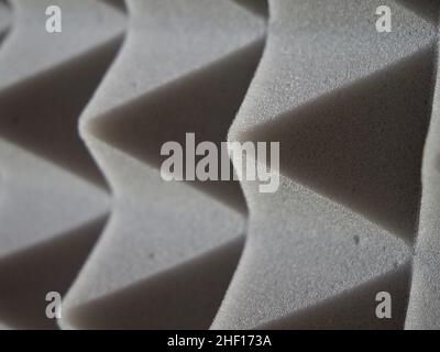 Pyramids of soundproof foam rubber, close-up. Sound-scattering material. Stock Photo