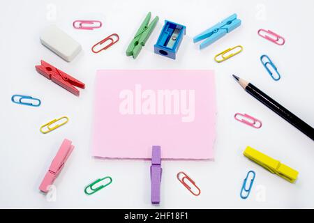 Set of colorful paper clips with white copy space background. Business creativity concepts. Flat lay design, can be used for presentation slides. Stock Photo