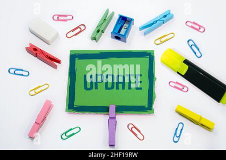 Text sign with Update written paperclips, clips stationary in background. Stock Photo