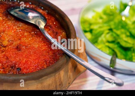 Minced meat in cabbage leaves, in a clay pot, close up photo Sarma Stock Photo