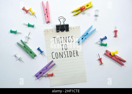 Text sign showing Things to Consider with copy space, stationery items in white background Stock Photo