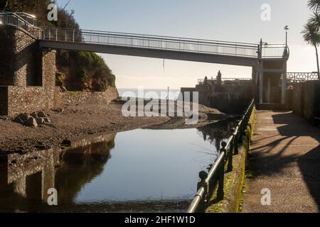 Silt building up across the mouth of the River Sid as it reaches the sea under the new Alma Bridge, on the South West Coastal Path at Sidmouth, Devon Stock Photo