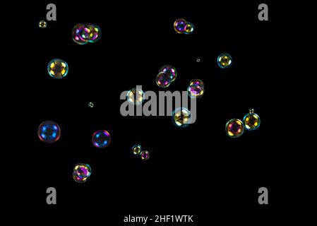 Soap bubbles isolated on a black background. Copy space. Stock Photo