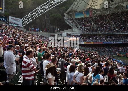 The crowd, at the Hong Kong Stadium, during the Hong Kong Sevens. It is considered the most important 7s rugby tournament in the world. Stock Photo