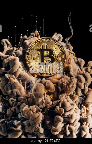 bitcoin coin and artistic background with color cloud. Stock Photo