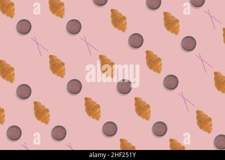 Creative pattern made of freshly baked croissant, glass of  chocolate milk and straw on bright pink background. Minimal homemade pastry concept. Stock Photo