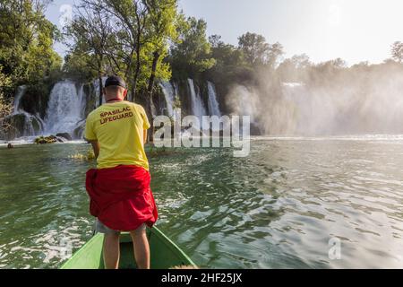 KRAVICA, BOSNIA AND HERZEGOVINA - JUNE 9, 2019: Lifeguard at Kravica waterfalls in Bosnia and Herzegovina Stock Photo