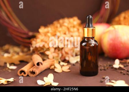 Apple essential oil in beautiful bottle on table Stock Photo by ©Solstzia  310657404