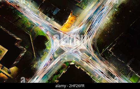 Looking down at the light trails on a roundabout in Ipswich, Suffolk, UK Stock Photo