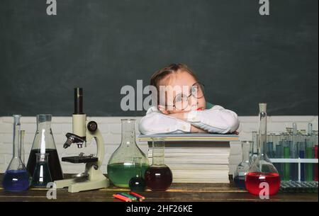 Back to school and home schooling. Little kids scientist earning chemistry in school lab. Kid from primary school. Stock Photo