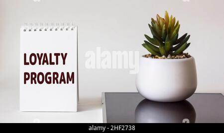 Notepad with word Loyalty program on white background Stock Photo