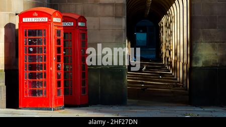 two red telephone boxes in the city UK Stock Photo