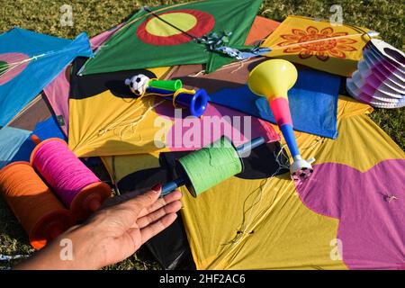 Sankranti kites patang flying outdoors. Colorful kites during kite festival. Makar sankranti festival celebrations. Kites on ground Stock Photo