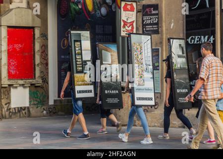 SARAJEVO, BOSNIA AND HERZEGOVINA - JUNE 12, 2019: Human billboards in Sarajevo, Bosnia and Herzegovina Stock Photo