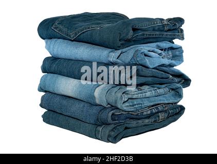 A stack of jeans in different colors on a white background. Jeans isolate with place for inscription Stock Photo