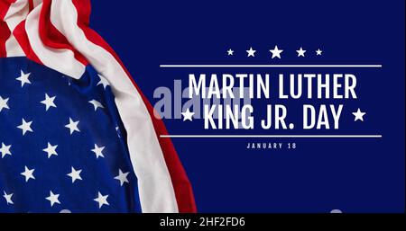 Digital composite of american flag by martin luther king jr day text on blue background Stock Photo