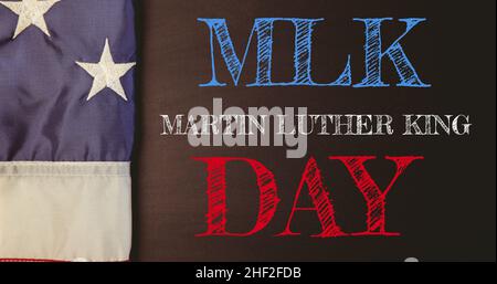 Overhead view of american flag by martin luther king day text on black background Stock Photo