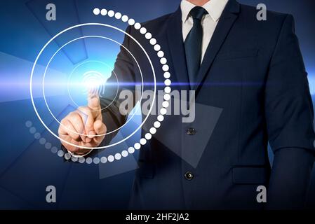 Man in jacket performing fingerprint scanning. Concept of secure access to the Internet and online connected platforms Stock Photo