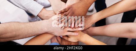 Diverse Multicultural Hand Stack In Circle. Multiracial Cohesive Supporting Hands Stock Photo