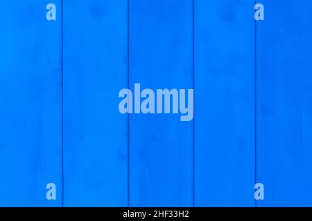 Vertical wooden boards painted in blue paint surface texture background. Stock Photo