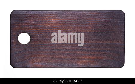 Top view of an old kitchen cutting board. Dark cutting board isolated on white background Stock Photo