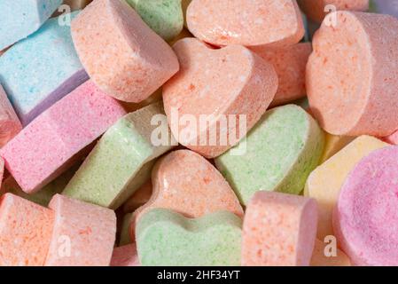 Powdered candies in various colors and shapes. Sweets for children. Sugar and calories. Stock Photo