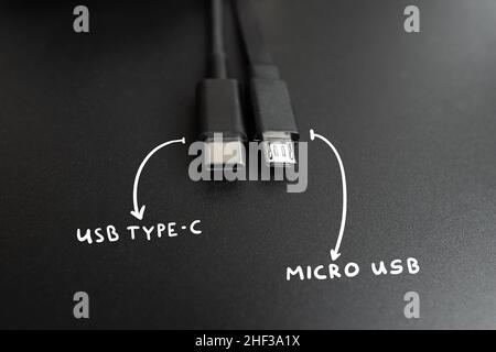 Connecting cables usb type C and micro wires. Popular and old technological standard Stock Photo