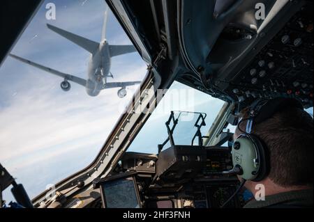 November 3, 2021 – Over the Gulf of Mexico near New Orleans, Maj. David Hutchins, a C-17 Instructor Pilot of the 183rd Airlift Squadron, 172nd Airlift Wing, Mississippi Air National Guard, aligns his aircraft for air-to-air refueling with a KC-46 tanker aircraft of the 157th Air Refueling Wing, New Hampshire Air National Guard.  The mission is in support of Operation Southern Lightning Strike 2021, an Air National Guard led exercise  where units deploy from their home bases to forward operating bases with minimum personnel and equipment to accomplish the mission in austere conditions. (U.S. Ai Stock Photo