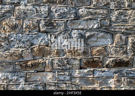 Weathered stone wall; historic Eastern State Penitentiary; Philadelphia; Pennsylvania; USA Stock Photo