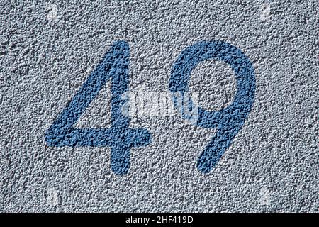 The house numbers forty nine  on the wall Stock Photo