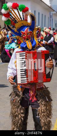 cuenca, Ecuador, Dec 24, 2021 - Man plays xylophone in the traditional Traveling Child Pase del Nino Christmas Eve Parade. Stock Photo