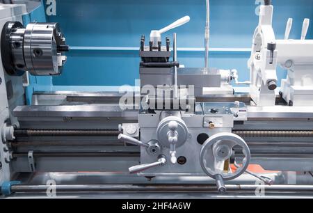 Metalworking. Close-up of lathe turning machine in industrial factory Stock Photo