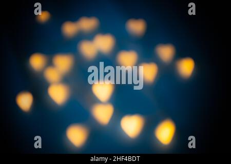 Abstract blurred heart-shaped lights background Stock Photo