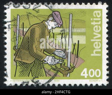 SWITZERLAND - CIRCA 1994: stamp printed by Switzerland, shows Wine Grower, circa 1994