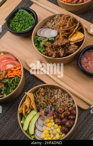 Chicken meal in bowls with vegetables and onion Stock Photo