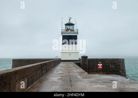 Lighthouse on the end of The Holyhead Breakwater, Holyhead, Anglesey, North Wales, UK Stock Photo