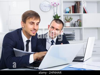 two young managers in office. Stock Photo