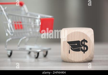 Wooden block with symbol of fafsa concept and trolley on background Stock Photo