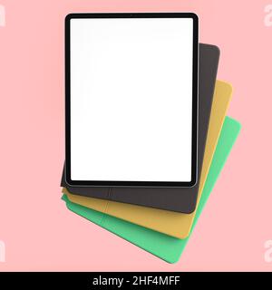 Set of computer tablets with cover case and blank screen isolated on pink. Stock Photo