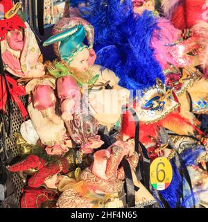 Decorated masks and dolls for sale at a stall, Carnevale di Venezia, Venice Carnival, Italy Stock Photo